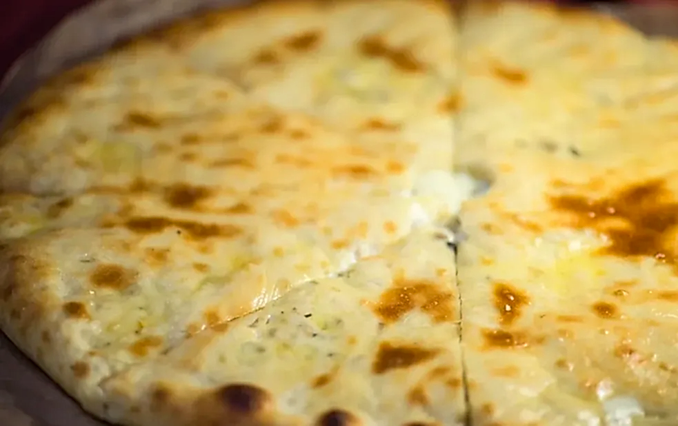 Осетинский пирог с авторской начинкой из сыра и зелени